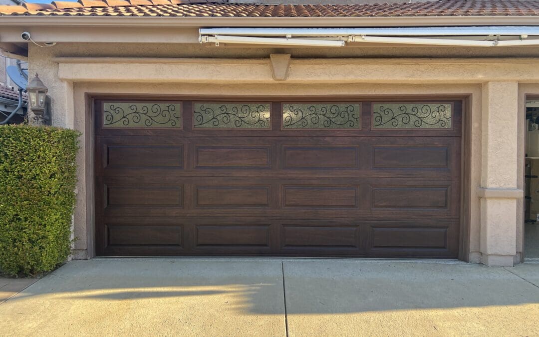 New garage doors and garage door openers installation in a Westlake Village home, featuring insulated panels and high-cycle blue torsion springs by Archway Garage Doors.